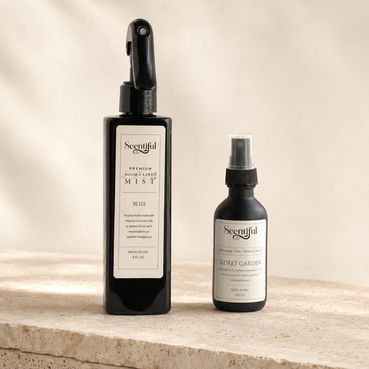 Scentiful Home & Roam mist pair: Bliss Room and Linen Mist and Secret Garden Auto + Travel Mist on a sunlit stone surface.